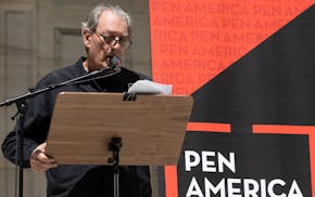 American writer Paul Auster speaks during a reading event in solidarity of support for author Salman Rushdie outside the New York Public Library in 20