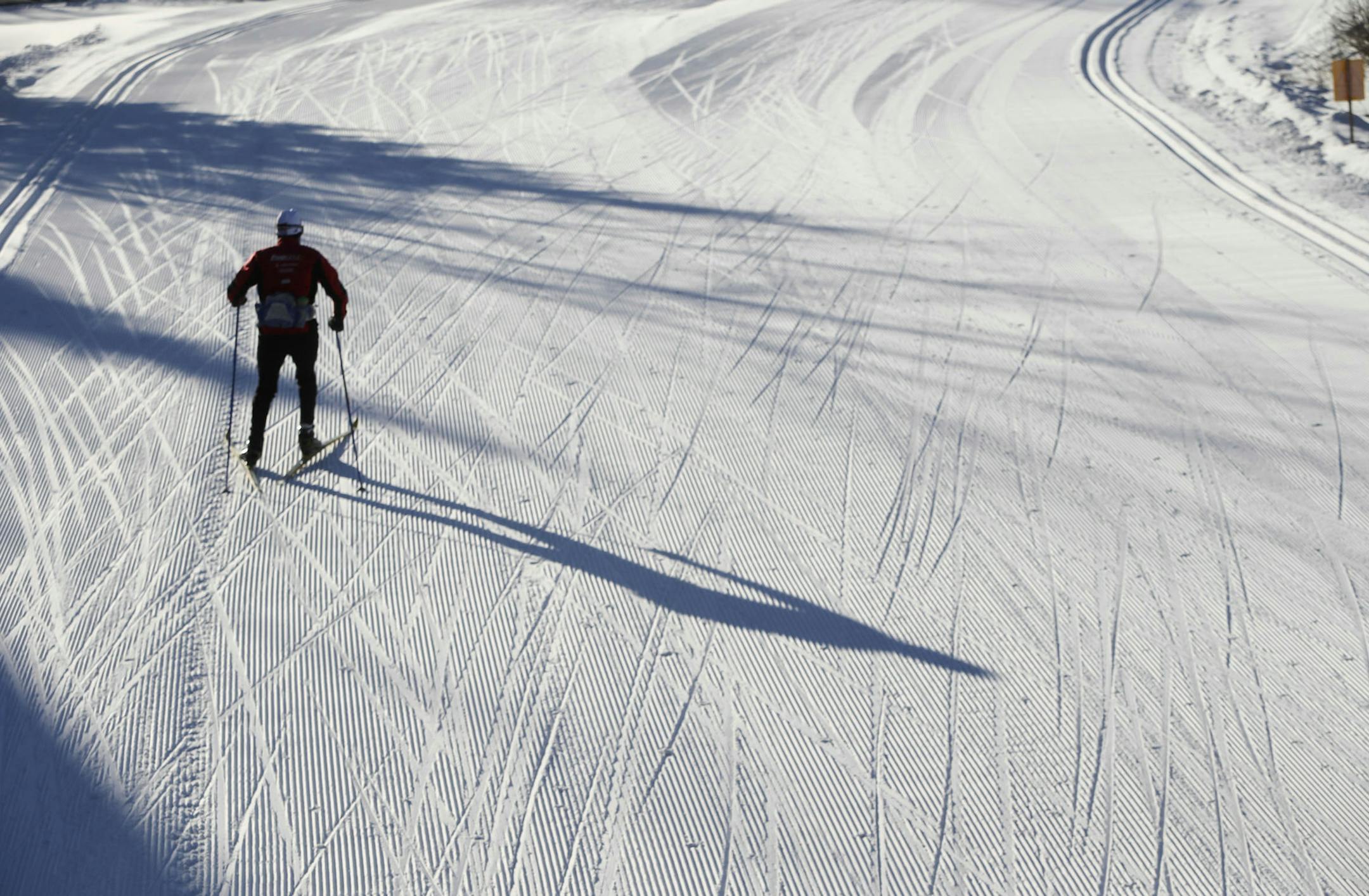 A cross country skier on a groomed trail casts a shadow Tuesday, Nov. 25, 2014, at Elm Creek Park Reserve in Maple Grove.](DAVID JOLES/STARTRIBUNE)djoles@startribune Snow and lots of it is on the ground at Elm Creek Park Reserve, a Three Rivers Park District property, for cross country skiers hoping to get an early start on winter.