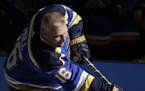 Former hockey player Brett Hulls shoots during the Skills Competition, part of the NHL All-Star weekend, Friday, Jan. 24, 2020, in St. Louis. (AP Phot