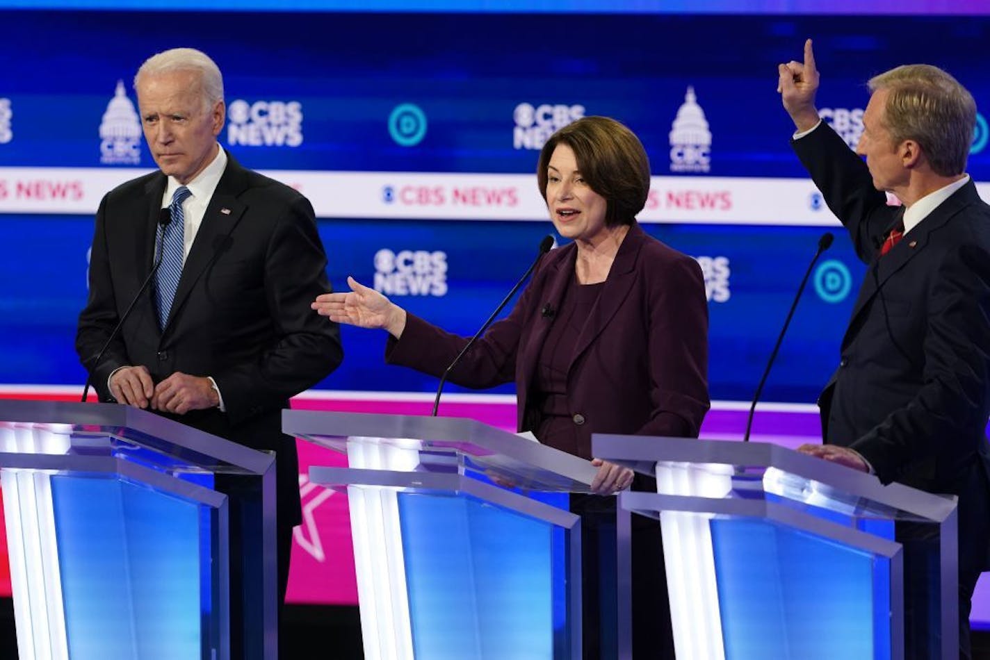 Sen. Amy Klobuchar (D-Minn.) speaks as former Vice President Joe Biden, left, and Tom Steyer listen during the Democratic presidential debate at the Gaillard Center in Charleston, S.C., Feb. 25, 2020.