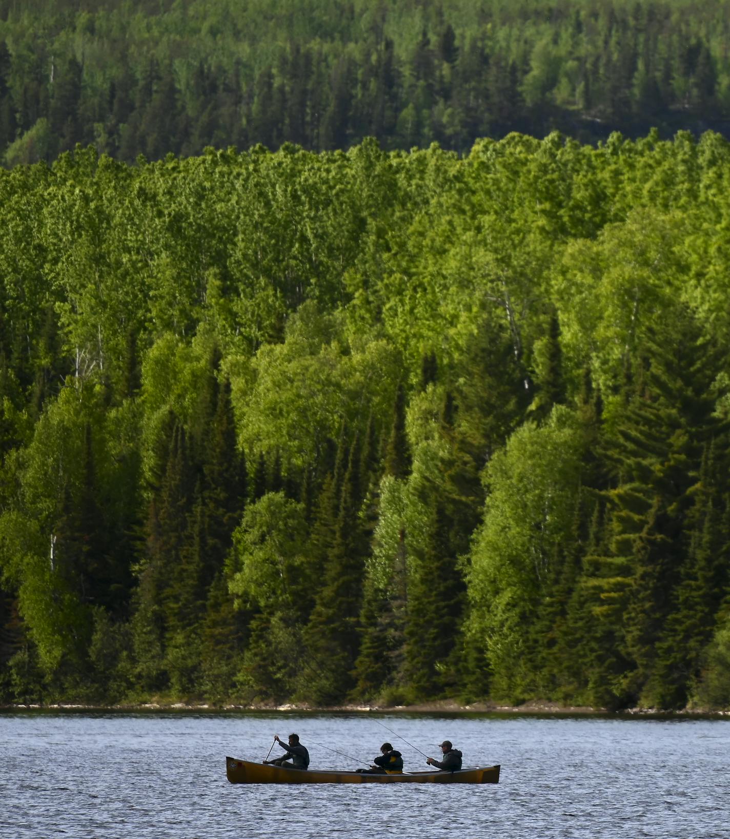 From left, Bob Timmons, Aidan Jones and Tony Jones fished Rose Lake Wednesday evening. ] Aaron Lavinsky &#xa5; aaron.lavinsky@startribune.com DAY 2 - Tony Jones, his 14-year old son Aiden, their friend Brad Shannon and Outdoors editor Bob Timmons started the day on South Lake on Wednesday, June 12, 2019. They portaged directly from their camp site into Rat Lake and then portaged into Rose Lake, where they set up camp for the night. ORG XMIT: MIN1906271645332959