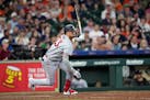 Minnesota Twins’ Royce Lewis hits an RBI single against the Houston Astros during the ninth inning of baseball game Monday, May 29, 2023, in Houston