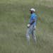 Dustin Johnson hits from some tall fescue on the 12th hole during a practice round for the U.S. Open golf tournament Wednesday, June 14, 2017, at Erin