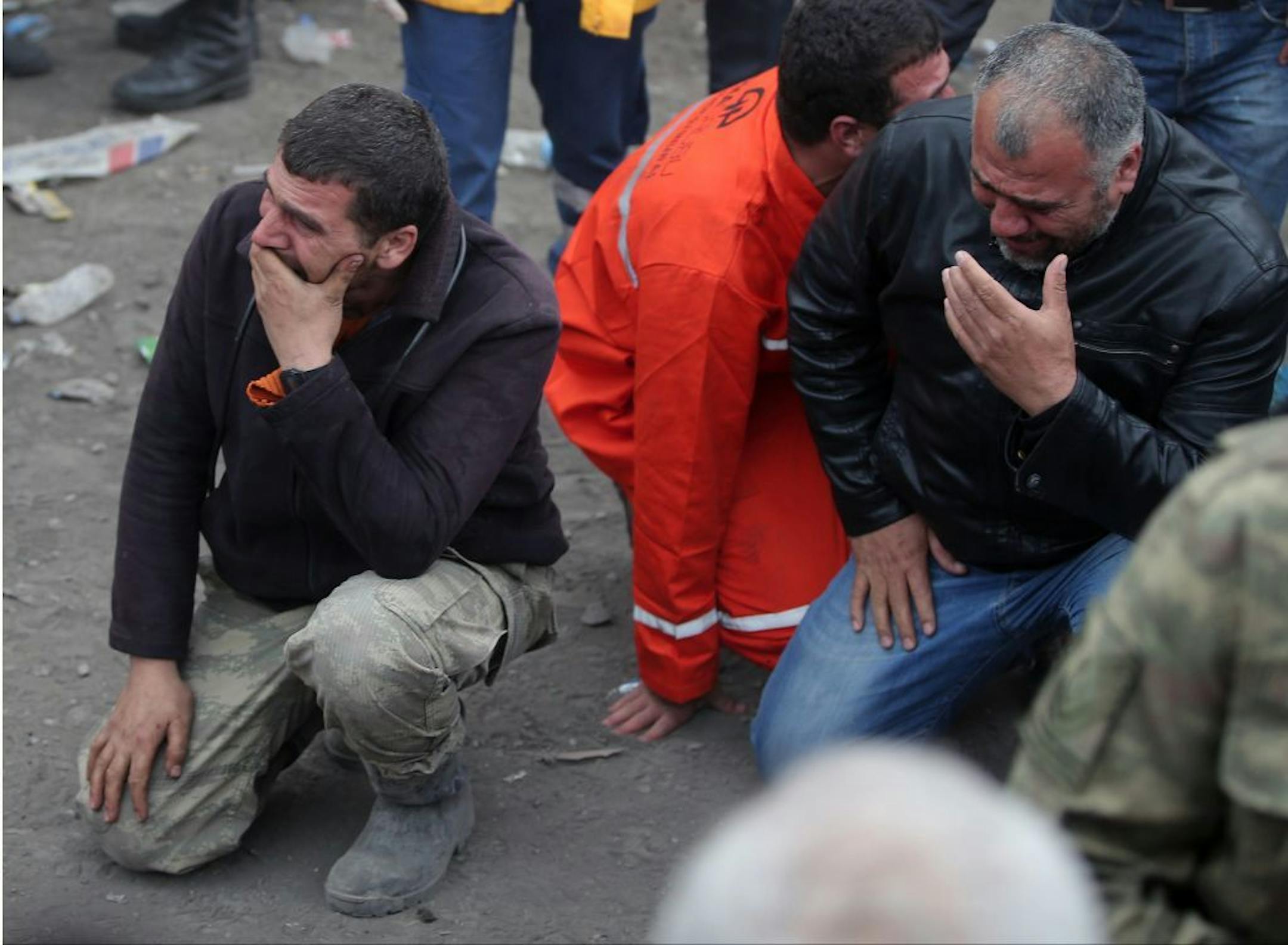 Family members, react, as they wait outside the mine in Soma, western Turkey, Wednesday, May 14, 2014.