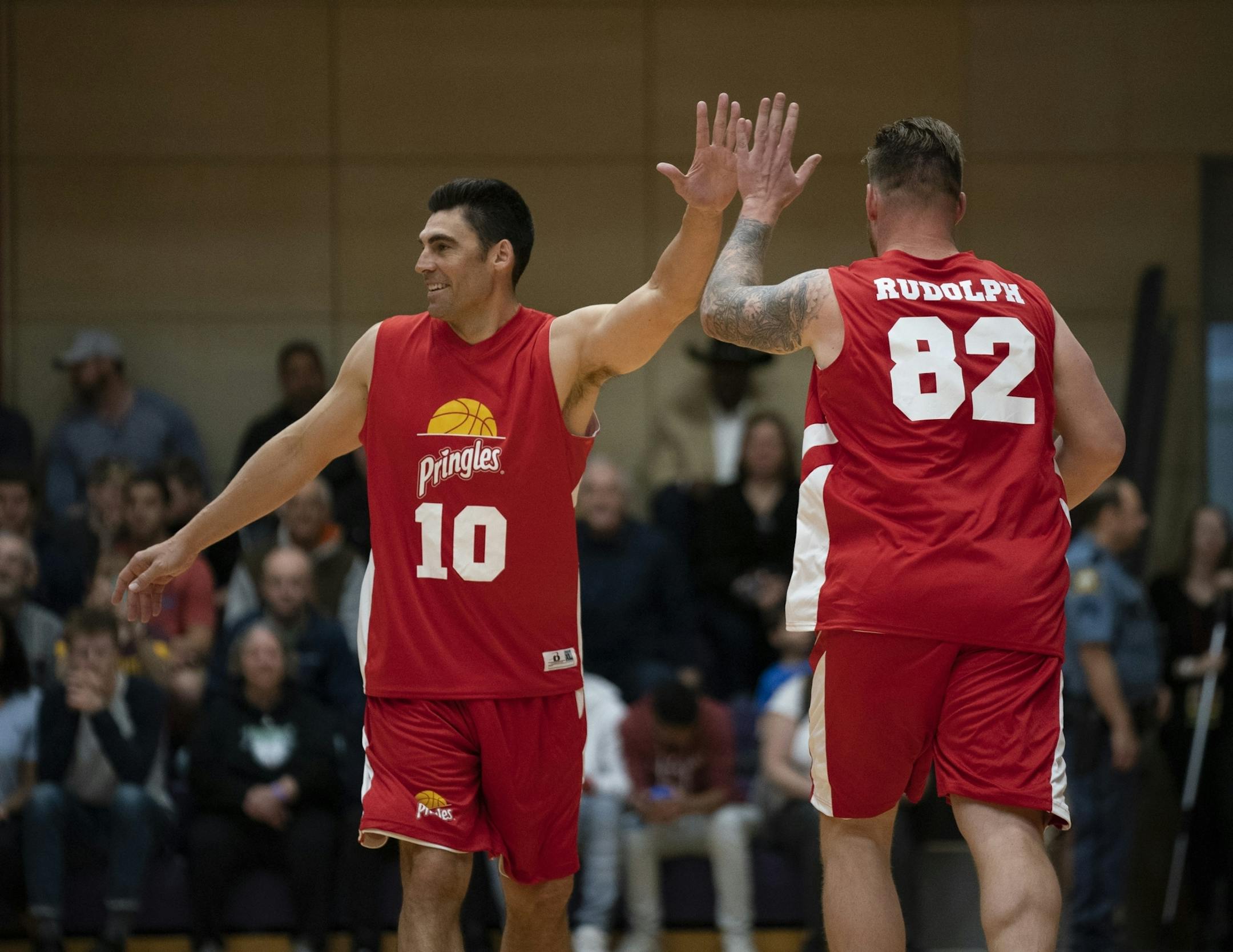 Team Pringles' Wally Szcerbiak and Kyle Rudolph high fived after a Rudolph basket.
