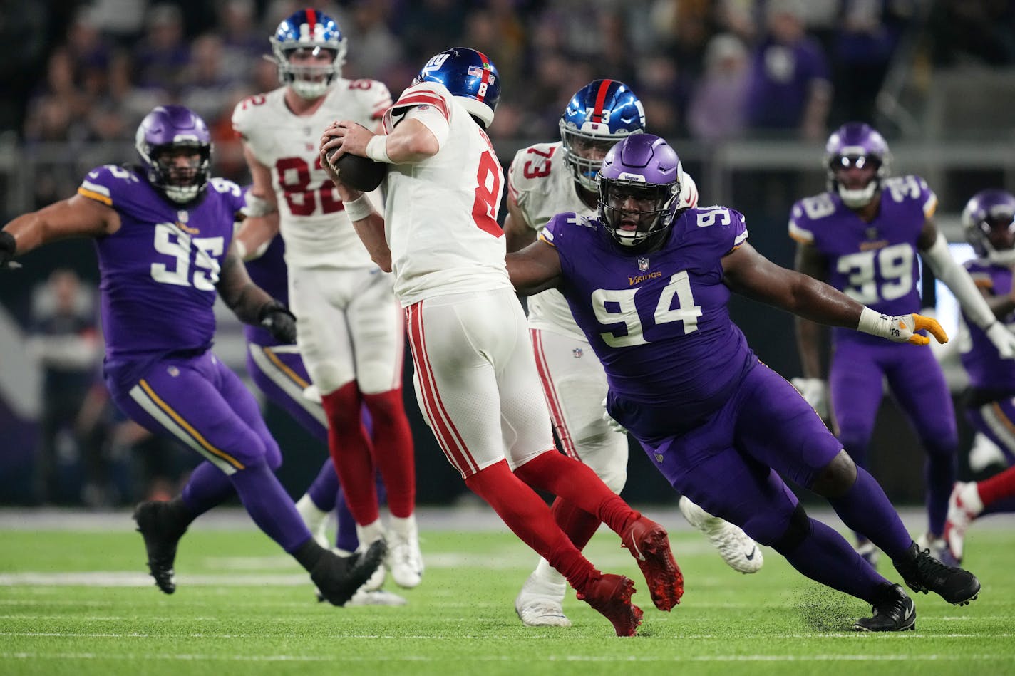 Minnesota Vikings defensive tackle Dalvin Tomlinson (94) gets a hand on New York Giants quarterback Daniel Jones (8) in the fourth quarter of an NFL wild card playoff game between the Minnesota Vikings and the New York Giants on Sunday, Jan. 15, 2023 at U.S. Bank Stadium in Minneapolis. ] ANTHONY SOUFFLE • anthony.souffle@startribune.com