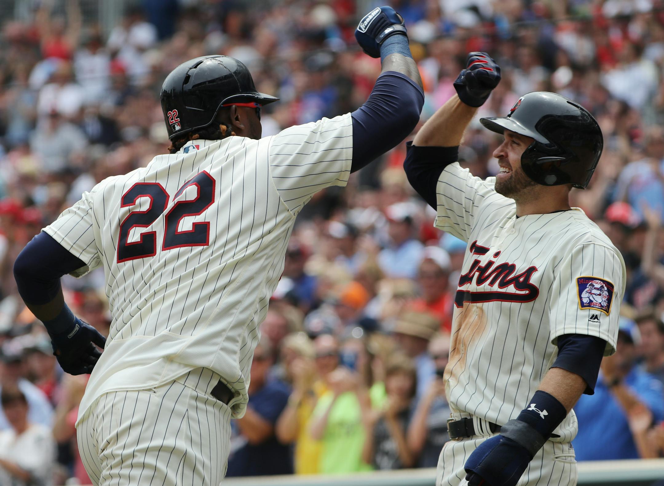 Miguel Sano(22) who just drove in Brian Dozier(2), right, and Eduardo Escobar(5) not pictured, heads to the dugout..] Twins take on the Yankees at Target Field in final game of 3-game series.Richard Tsong-Taatarii/Richard Tsong-taatarii@startribune.com