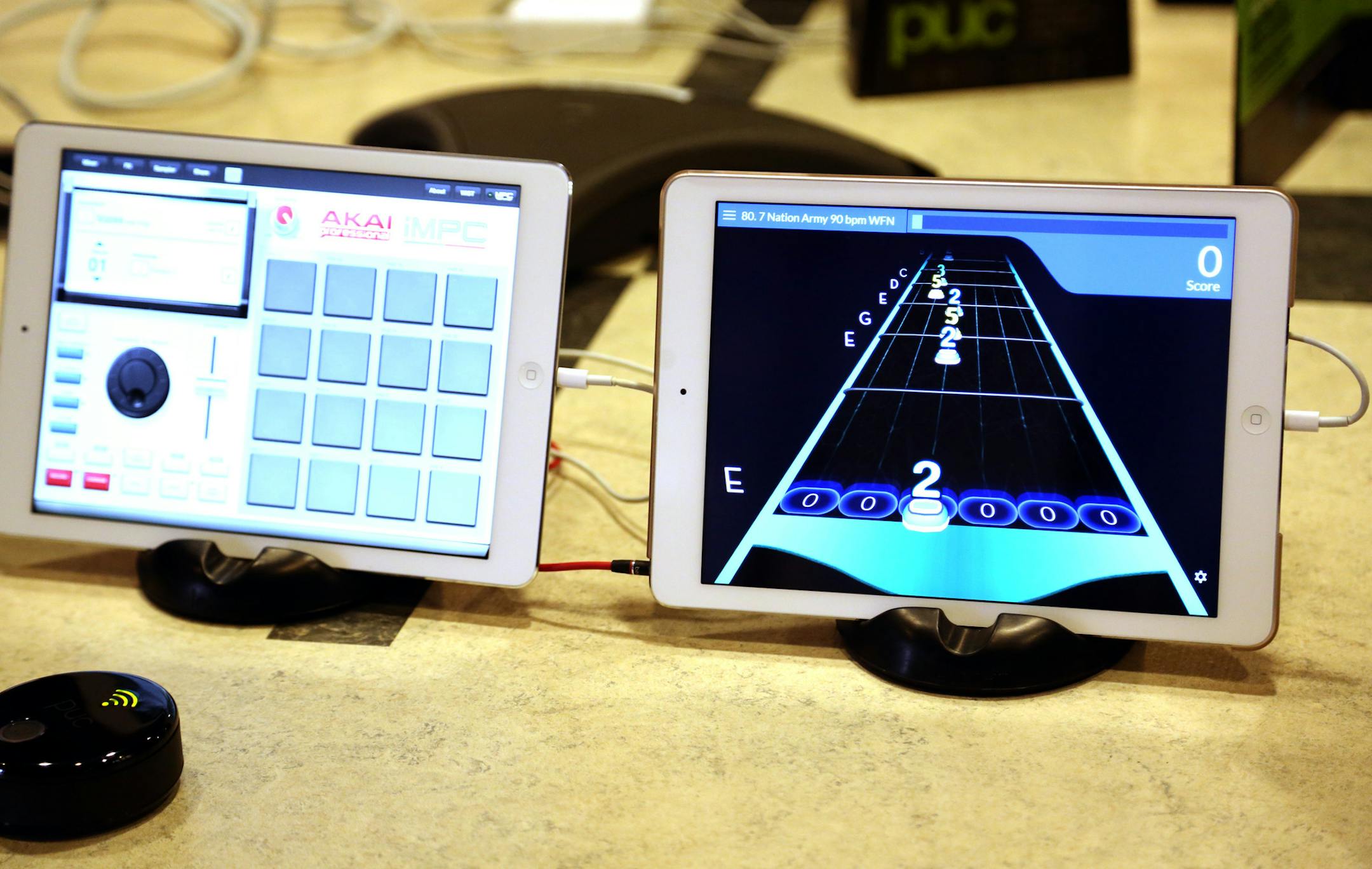 Chris Heille, music product specialist at Zivix, showed the arcade part of the tutorial that comes with their product the JamStik. ] (KYNDELL HARKNESS/STAR TRIBUNE) kyndell.harkness@startribune.com Zivix is in the wireless music business. It makes the PUC, which wirelessly connects musical instruments to an iPad being used for composing. It also makes the JamStik, a portable instrument that mimics a guitar and connects wirelessly to an iPad in Minneapolis, Min.Thursday, June 12, 2014.