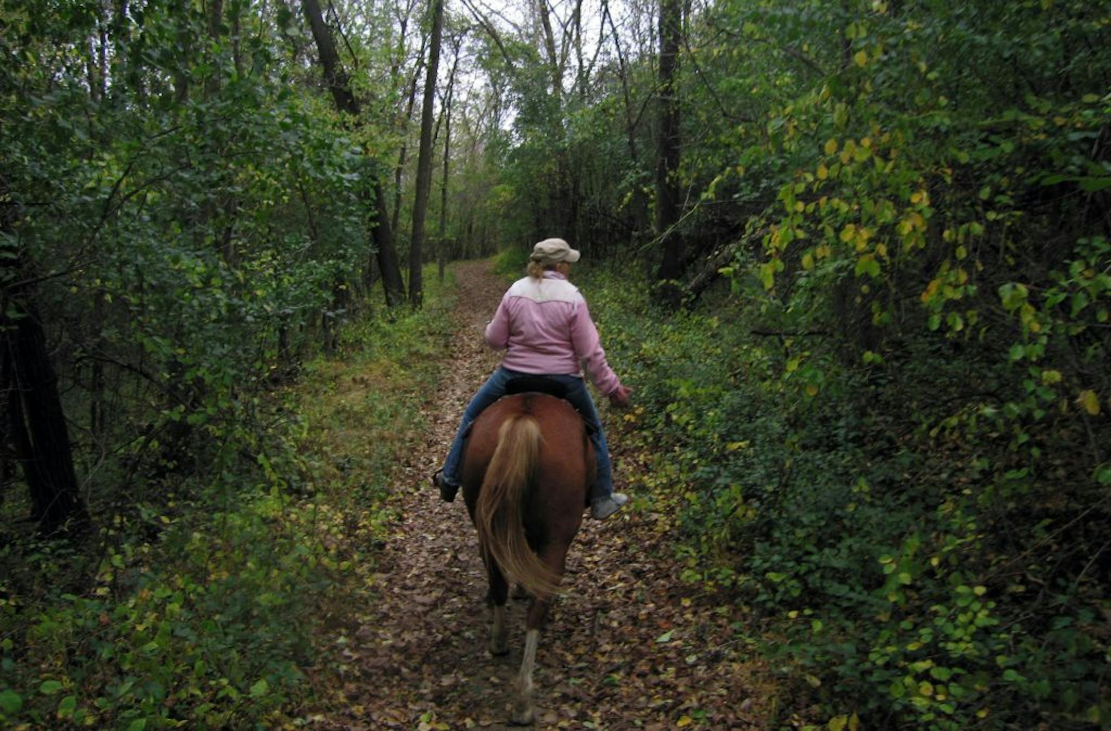 Lorrie Rinn leads a trail ride from Big Valley Ranch in Winona.