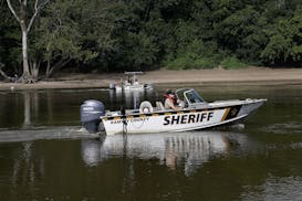 Here, Ramsey County Sheriff's Deputies in boats searched for a young boy who went missing late Tuesday along the Mississippi River near Hidden Falls R