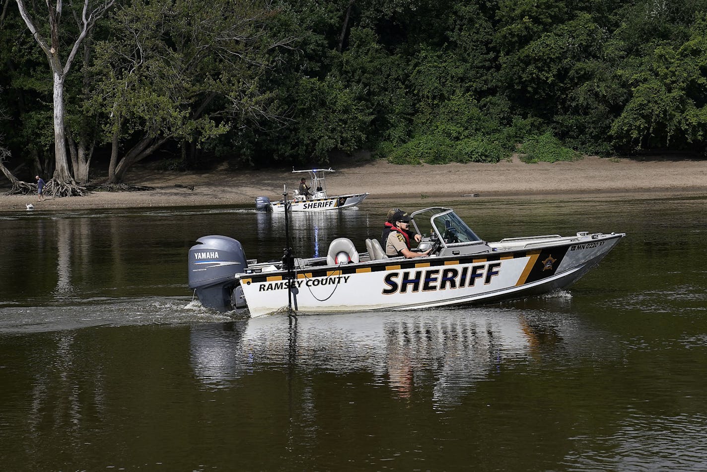 Here, Ramsey County Sheriff's Deputies in boats searched for a young boy who went missing late Tuesday along the Mississippi River near Hidden Falls Regional Park Wednesday in St. Paul.