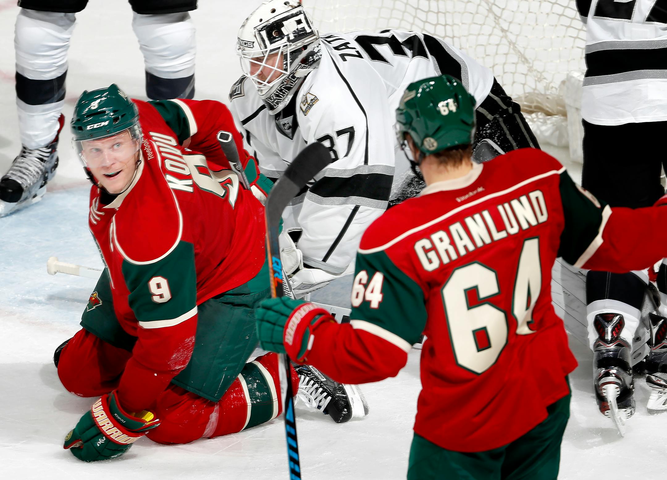 Mikko Koivu (9) and Mikael Granlund (64) celebrated after Koivu shot the puck past Kings goalie Jeff Zatkoff last season.