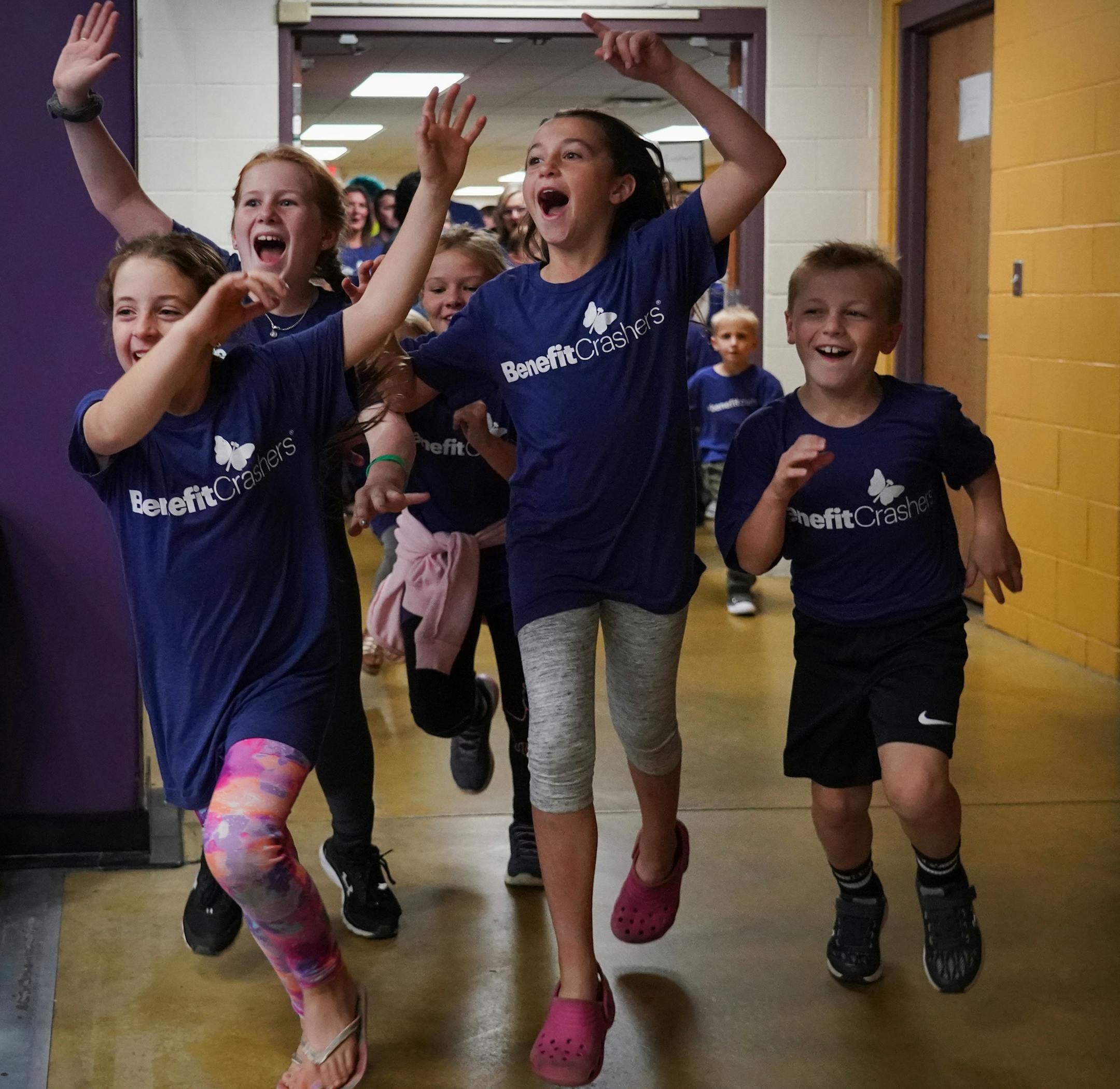 Over 50 adults and kids with the Benefit Crashers made a surprise entrance at a benefit for Cheri Ventrucci and her husband Alex. ] Shari L. Gross ¥ shari.gross@startribune.com Story about a group called the Benefit Crashers. These wild and crazy volunteers crash benefits to make sure those benefits are a success. They show up as a surprise to the folks running the benefit. This is a benefit for Cheri Ventrucci, a recent second time mother, who gave birth to her beautiful daughter on March