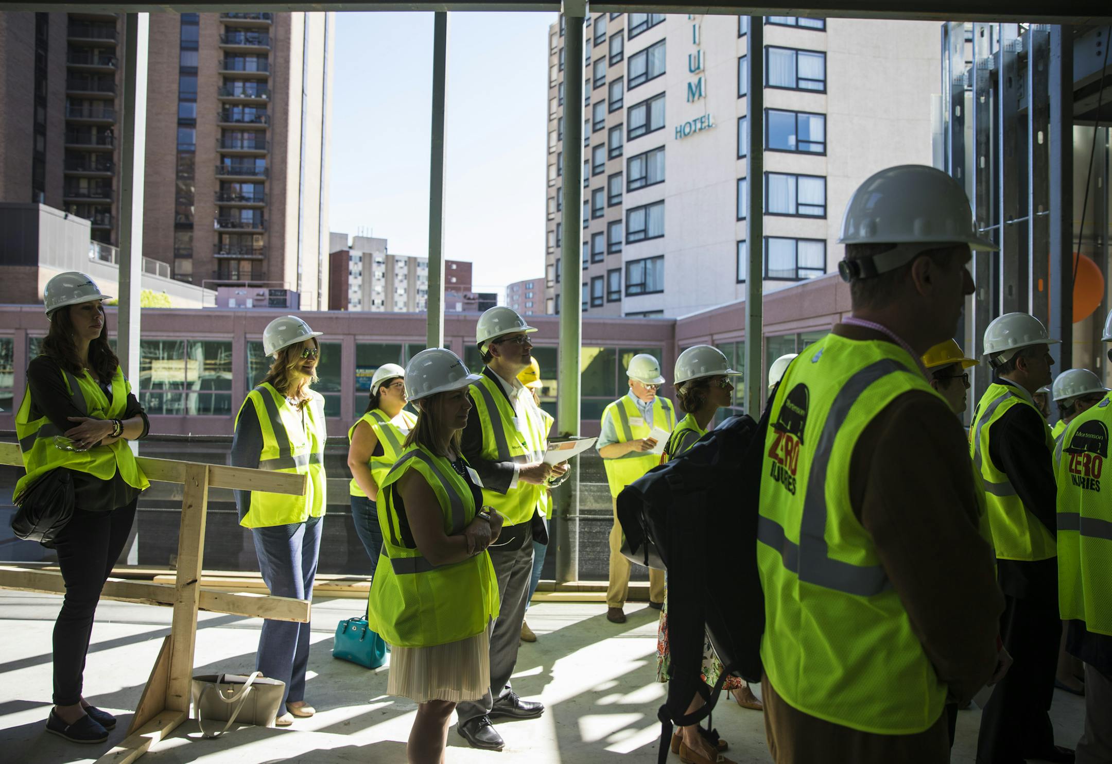 A crowd of people gathered in hard hats during a ceremony celebrating the ongoing construction on the Harman Center for Child & Family Wellbeing at the St. David's Center in Minneapolis, Minn., on Wednesday, May 31, 2017. ] RENEE JONES SCHNEIDER • renee.jones@startribune.com