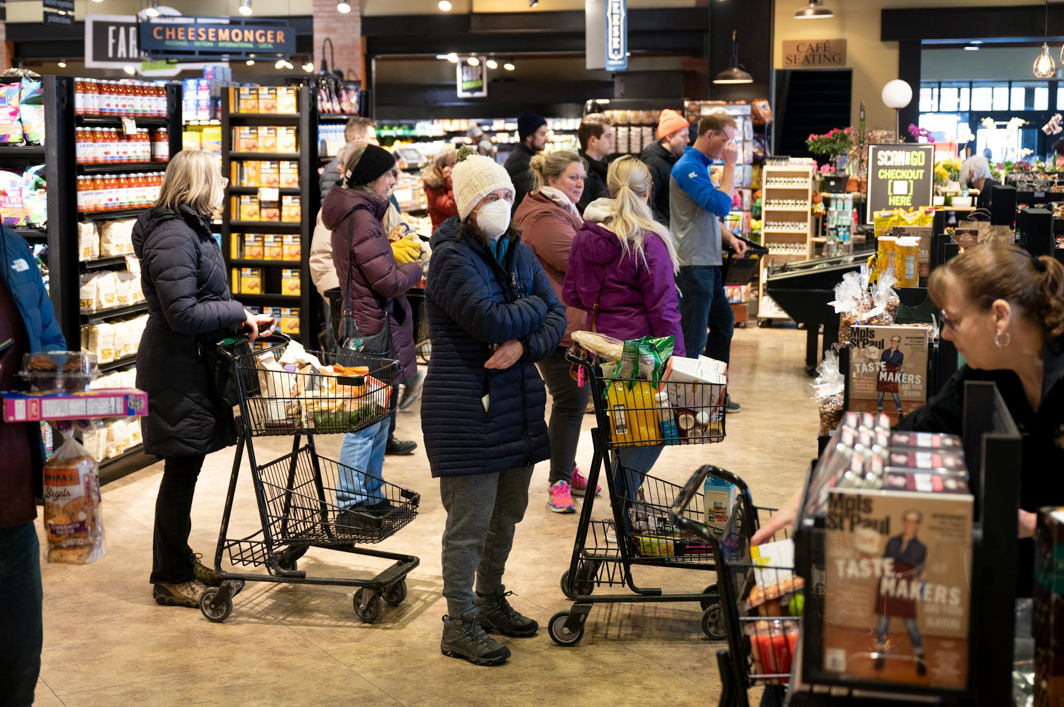 Shoppers line up to check out Tuesday at Kowalski's off of Lyndale Avenue South in Minneapolis.