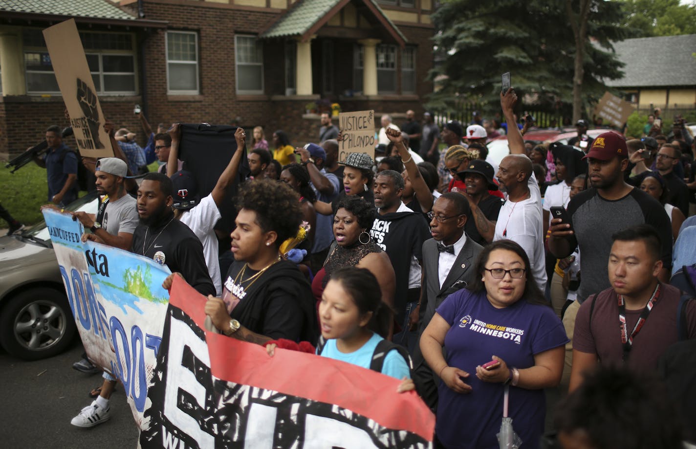 Valerie Castile, the mother of Philando Castile, center, was among the family members who led marchers from the J.J. Hill Montessori Magnet School to the Governor's Mansion. ] JEFF WHEELER &#xef; jeff.wheeler@startribune.com Hundreds attended a vigil for Philando Castile at J.J. Hill Montessori Magnet School in St. Paul Thursday evening, July 7, 2016, where he was a nutrition services supervisor. Led by his family, many then marched to the Governor's Mansion nearby.