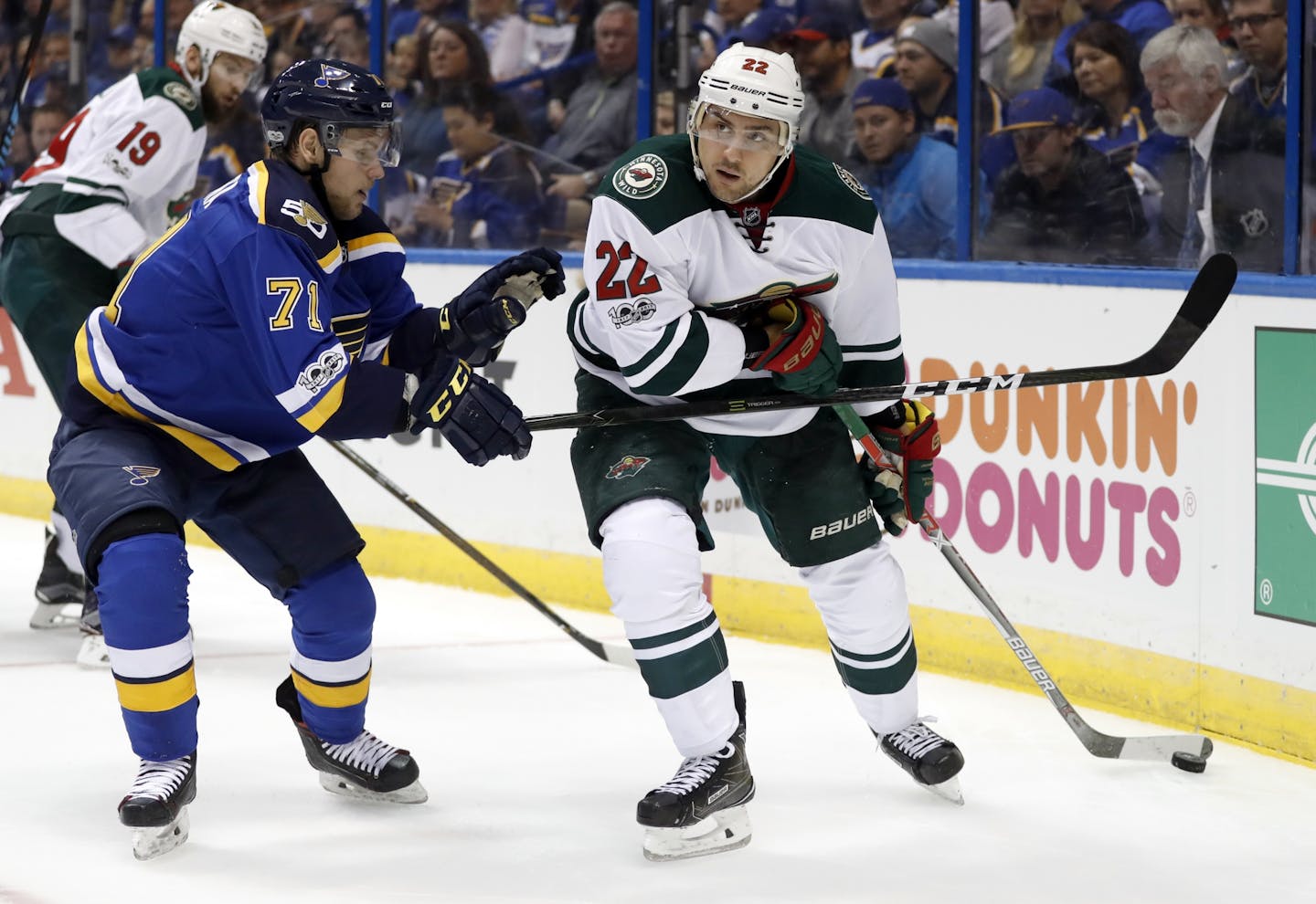 Minnesota Wild's Nino Niederreiter, of Switzerland, looks to pass as St. Louis Blues' Vladimir Sobotka, left, of the Czech Republic, defends during the first period in Game 3 of an NHL hockey first-round playoff series Sunday, April 16, 2017, in St. Louis.