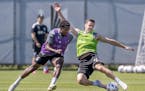 Minnesota United FC defender Jukka Raitala, right, and midfielder Justin McMaster, left, battled for the ball during practice at the National Sports C
