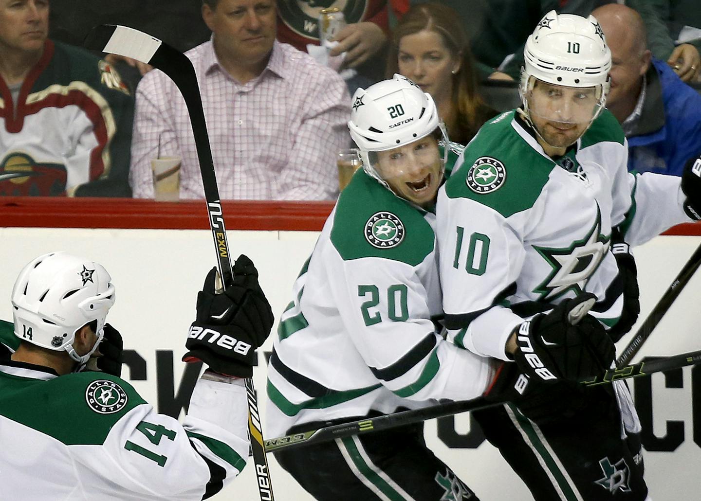 Jamie Benn (14), Cody Eakin (20) and Patrick Sharp (10) celebrated a goal by Sharp in the first period. ] CARLOS GONZALEZ cgonzalez@startribune.com - April 18, 2016, St. Paul, MN, Xcel Energy Center, NHL, Hockey, Minnesota Wild vs. Dallas Stars, First Round Stanley Cup Playoffs, Game 3