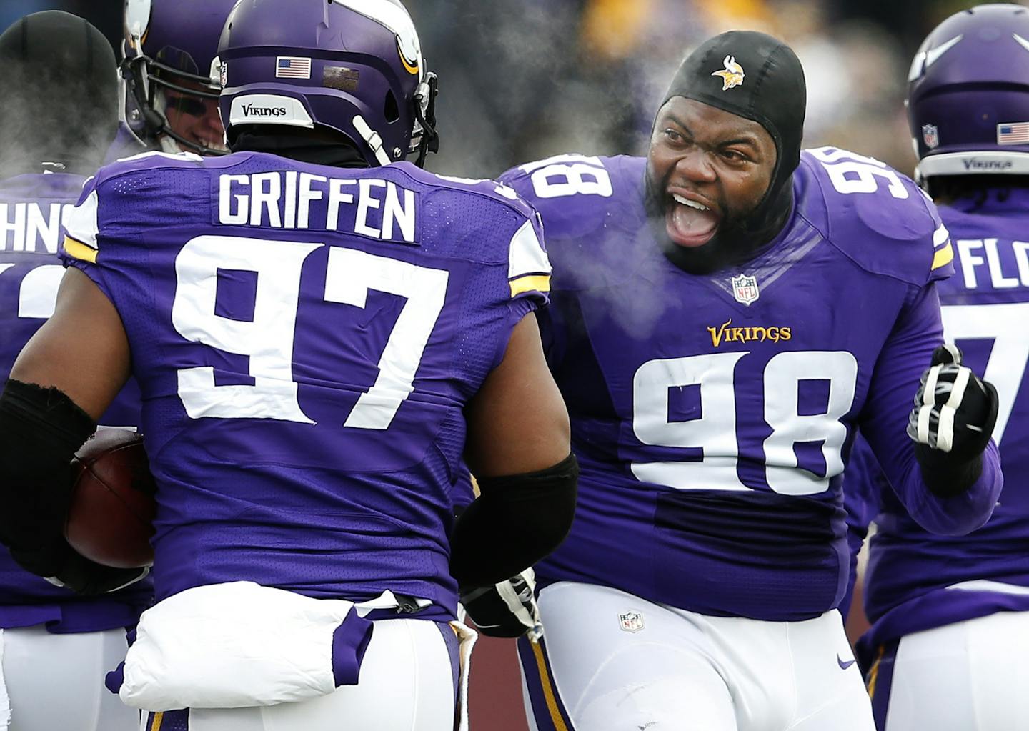 Linval Joseph (98) made a running motion at Everson Griffen (97) after Griffen returned a blocked punt 43-yards for a touchdown in the second quarter.