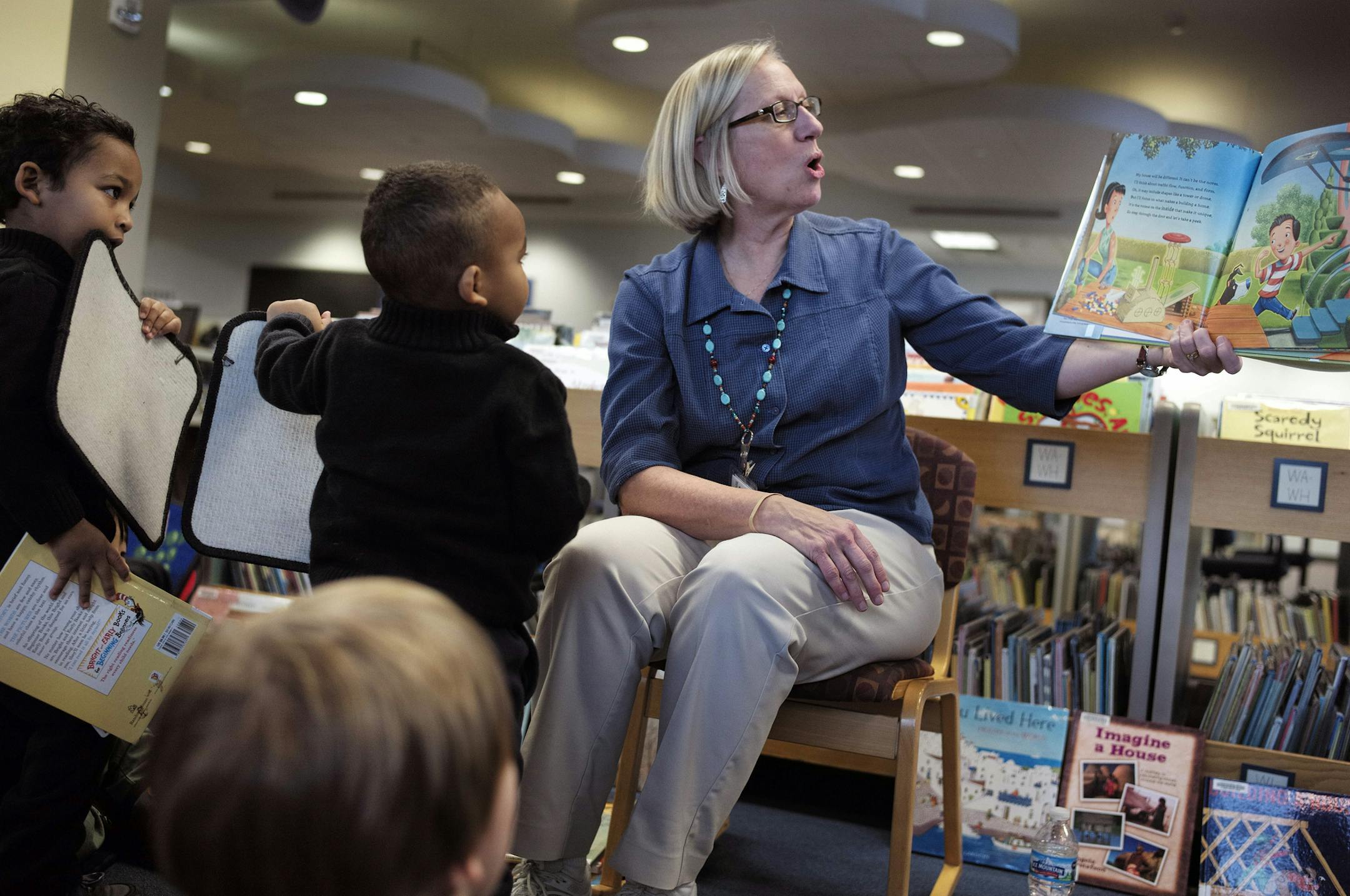 At Stafford Library in Woodbury, librarian Marty Hoekstra read to preschoolers using the theme of homes. Usually 30-40 people attend reading time .]Richard Tsong-Taatarii/ rtsong- taatarii@startribune.com