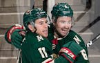 Zach Parise (11) and Ryan Murphy (6) celebrate a Parise goal in the second period as the Minnesota WIld take on the Los Angeles Kings Monday, March 19