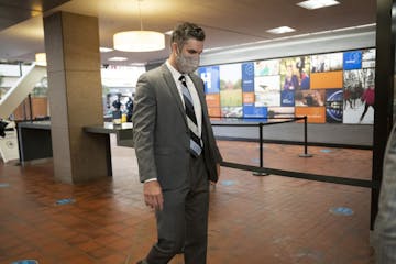 Former police officer Thomas Lane walks through security as he arrived for a hearing at the Hennepin County Government Center in Minneapolis on July 2