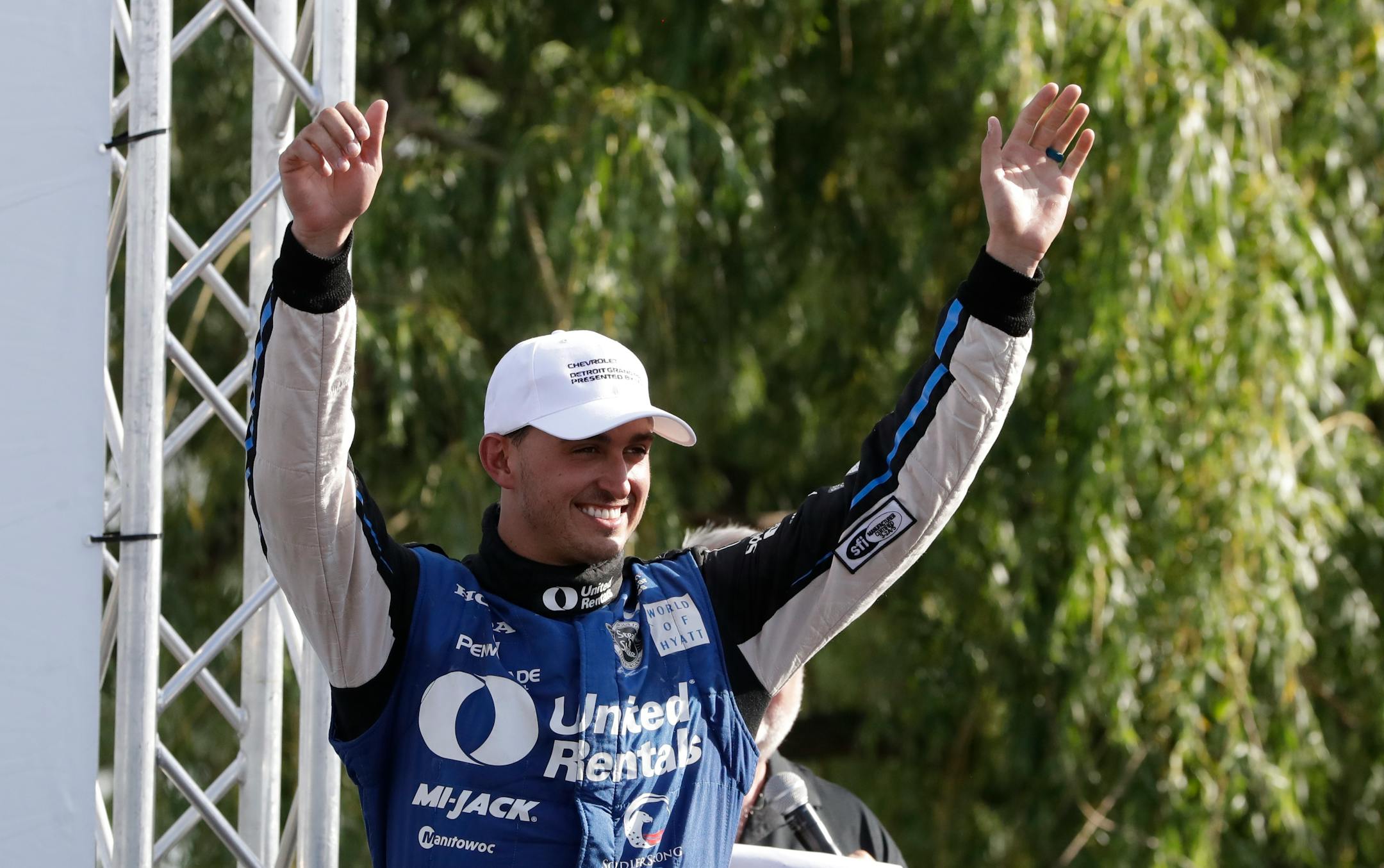 Graham Rahal acknowledged the fans as he approaches the winner's podium after the IndyCar Detroit Grand Prix auto race on Belle Isle, Sunday, June 4, 2017, in Detroit. Rahal completed a doubleheader sweep in the race to become IndyCar's first two-time winner this season.