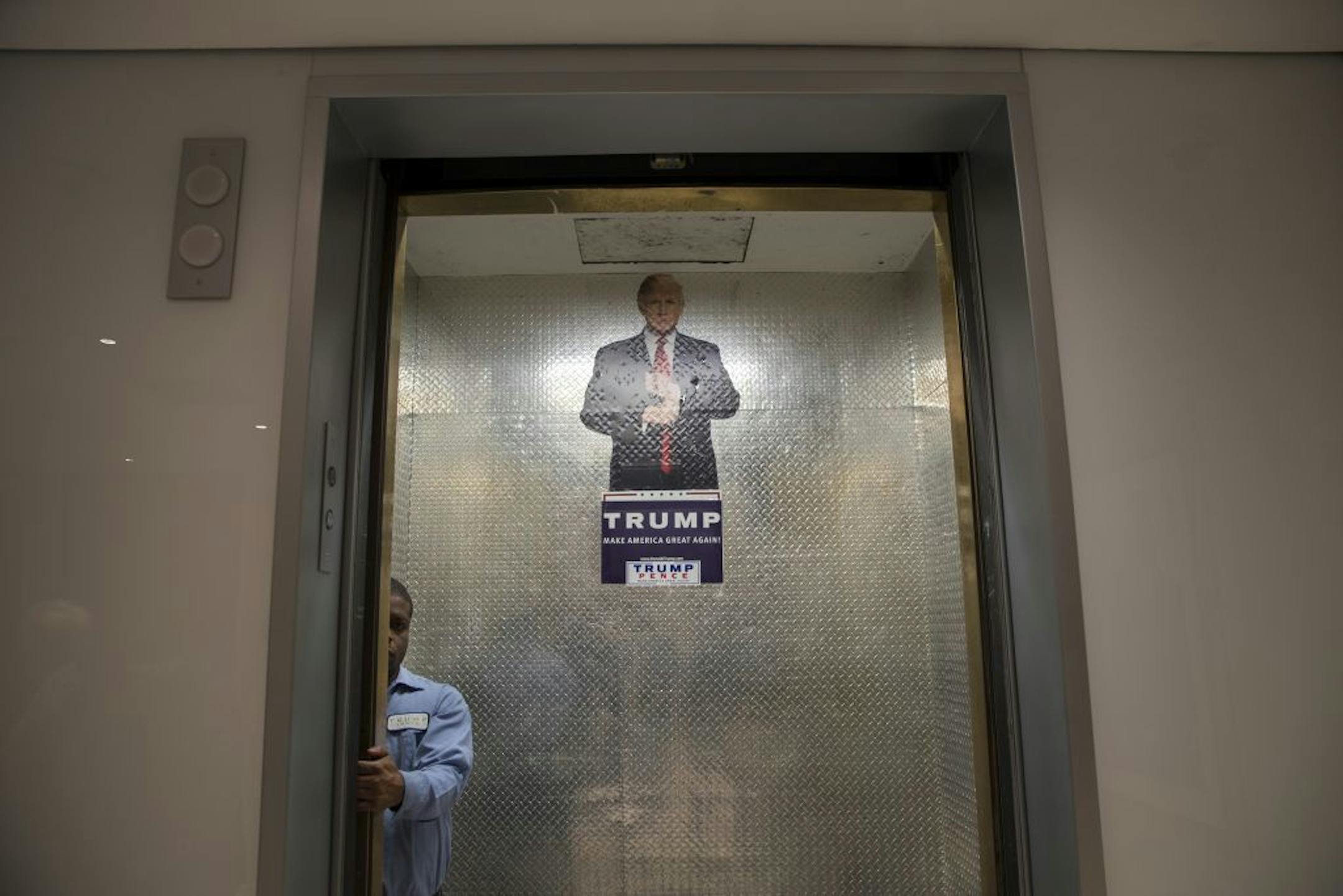 A campaign sign in an elevator at Trump Tower, where Donald Trump met with his team of advisors and the National Border Patrol Council that day, in New York, Oct. 7, 2016. Trump�s campaign was teetering Saturday after the release of a video in which he speaks of women in vulgar sexual terms, with more Republican leaders calling for him to leave the ticket and demanding that the party shift focus to down-ballot races.