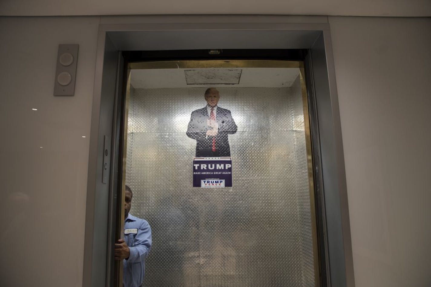 A campaign sign in an elevator at Trump Tower, where Donald Trump met with his team of advisors and the National Border Patrol Council that day, in New York, Oct. 7, 2016. Trump�s campaign was teetering Saturday after the release of a video in which he speaks of women in vulgar sexual terms, with more Republican leaders calling for him to leave the ticket and demanding that the party shift focus to down-ballot races.