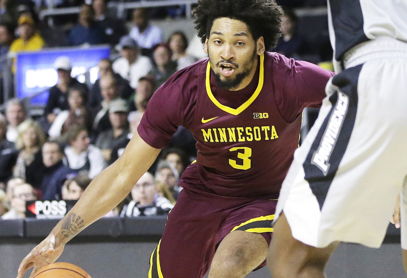 Minnesota's Jordan Murphy (3) tries to drive past Providence's Kalif Young (13) in the first half of an NCAA college basketball game Monday, Nov. 13, 2017, in Providence, R.I. Minnesota won 86-74. (AP Photo/Steven Senne) ORG XMIT: MIN2017111320181058