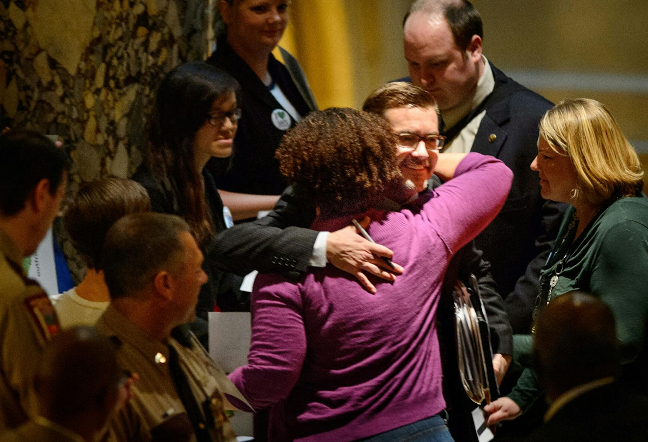 On the way to the Senate floor, anti-bullying bill sponsor Sen. Scott Dibble got a hug from supporter Nicque Mabrey of Outfront Minnesota, an LGBT rights group.goes up before the Senate for a vote. ] GLEN STUBBE * gstubbe@startribune.com Thursday, April 3, 2014.