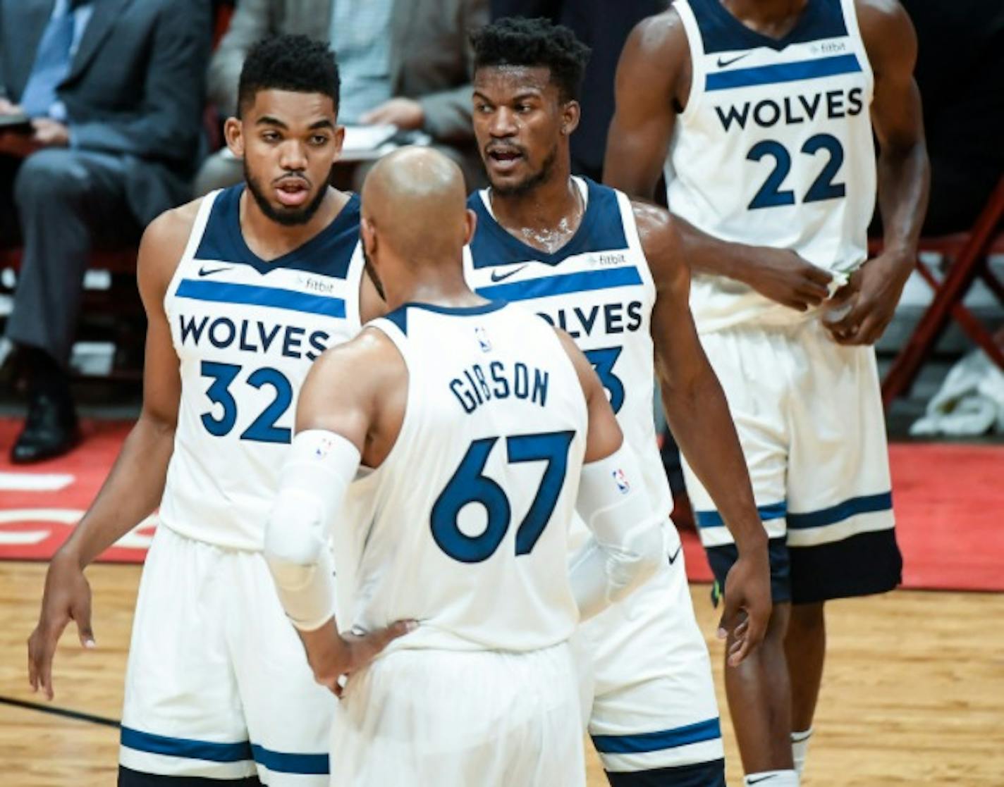 Minnesota Timberwolves center Karl-Anthony Towns (32), forward Taj Gibson (67) and forward Jimmy Butler (23) talked things over between plays in the first quarter Saturday against the Los Angeles Lakers.