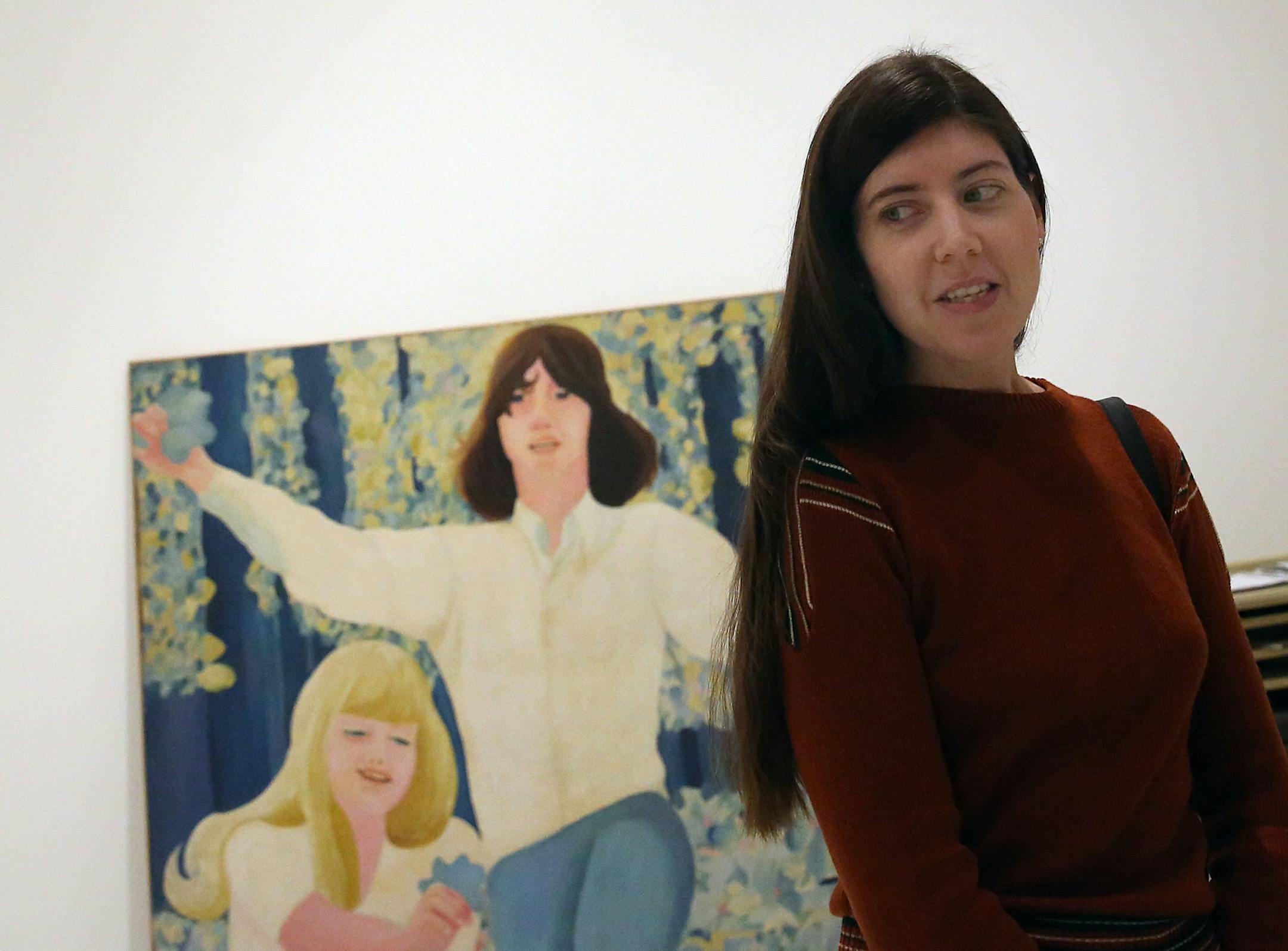 Jessica Rolland is senior associate registrar for the Walker Art Center. Behind Rolland is Retrato Muchachas y Muchachos: Antoine y Karine (Portrait of Girls and Boys: Antoine and Karine), 1966 (industrial acrylic on canvas and wood) by Delia Cancela and Pablo Mesejean Argentine, born 1940; Argentine, 1937-1991.