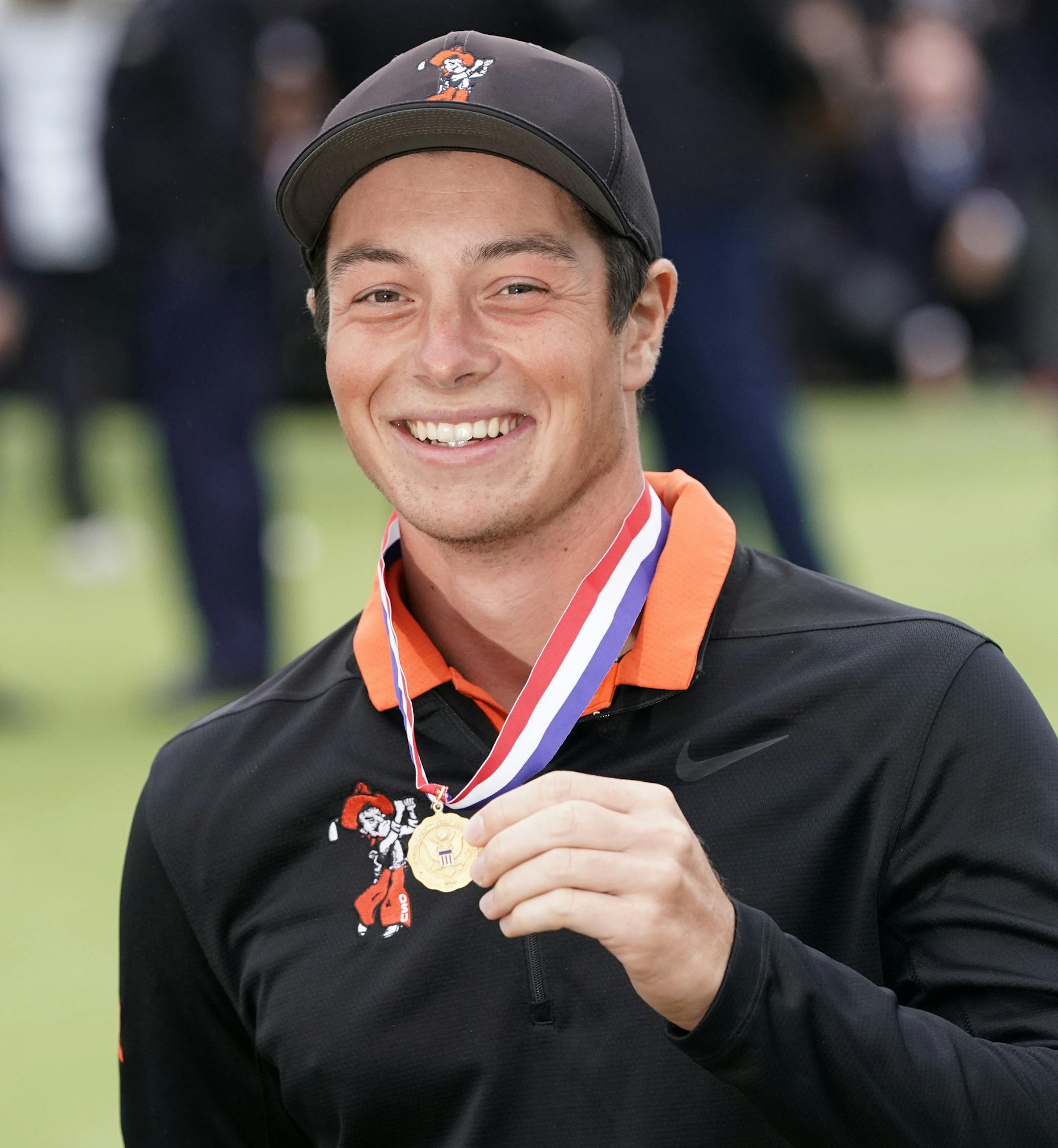 Amateur player, Viktor Hovland, of Norway, posses with the low amateur medal at the U.S. Open Championship golf tournament Sunday, June 16, 2019, in Pebble Beach, Calif. (AP Photo/David J. Phillip)
