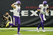 Minnesota Vikings wide receiver Adam Thielen (19) and quarterback Kirk Cousins (8) celebrates after they connected on a pass for a touchdown against t