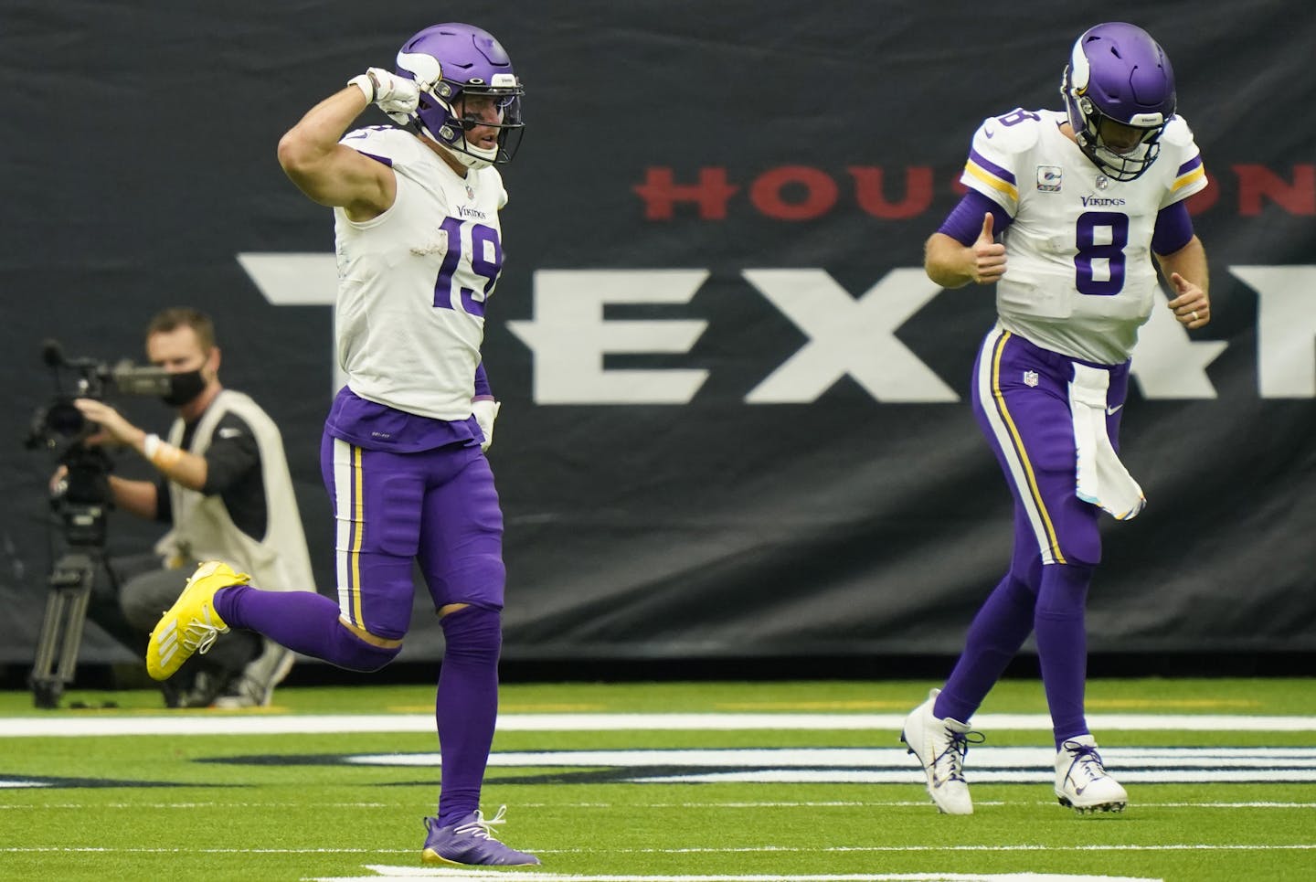 Minnesota Vikings wide receiver Adam Thielen (19) and quarterback Kirk Cousins (8) celebrates after they connected on a pass for a touchdown against the Houston Texans during the second half of an NFL football game Sunday, Oct. 4, 2020, in Houston. (AP Photo/David J. Phillip)