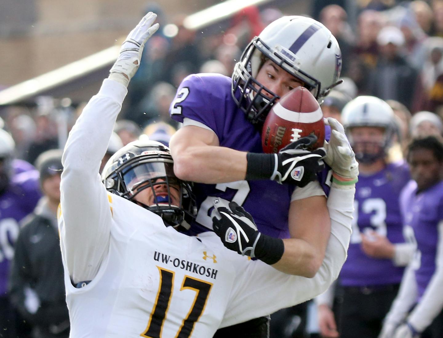 St. Thomas receiver Nick Waldvogel (2) hauls in a long reception from quarterback Alex Fenske while being covered by Wisconsin-Oshkosh's Johnny Eagan (17) during second quarter NCAA Div. III playoff action Saturday, Dec. 3, 2016, at O&#xed;Shaughnessy Stadium, University of St. Thomas, In St. Paul, MN.](DAVID JOLES/STARTRIBUNE)djoles@startribune.com NCAA Div. III playoff action