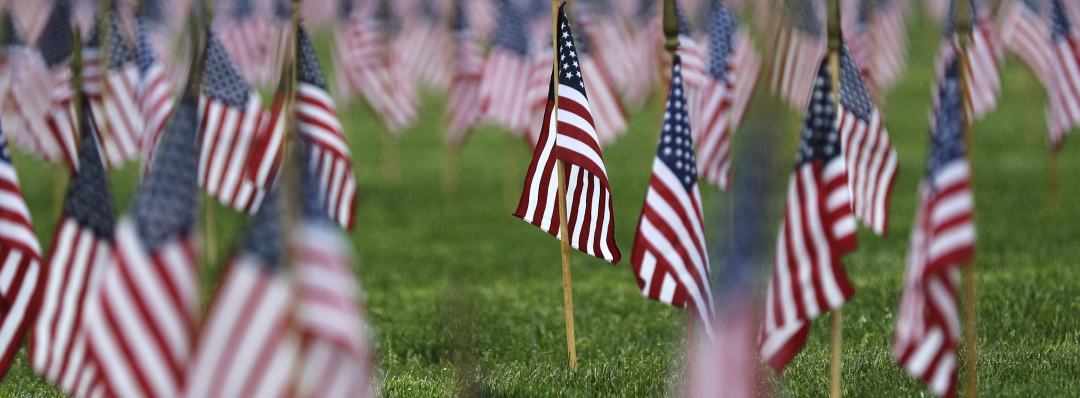 U.S. flags mark military gravestones at Tahoma National Cemetery, Friday, May 24, 2019, in Kent, Wash. Monday is Memorial Day, a U.S. federal holiday to honor those who died while serving in the military. (AP Photo/Ted S. Warren)