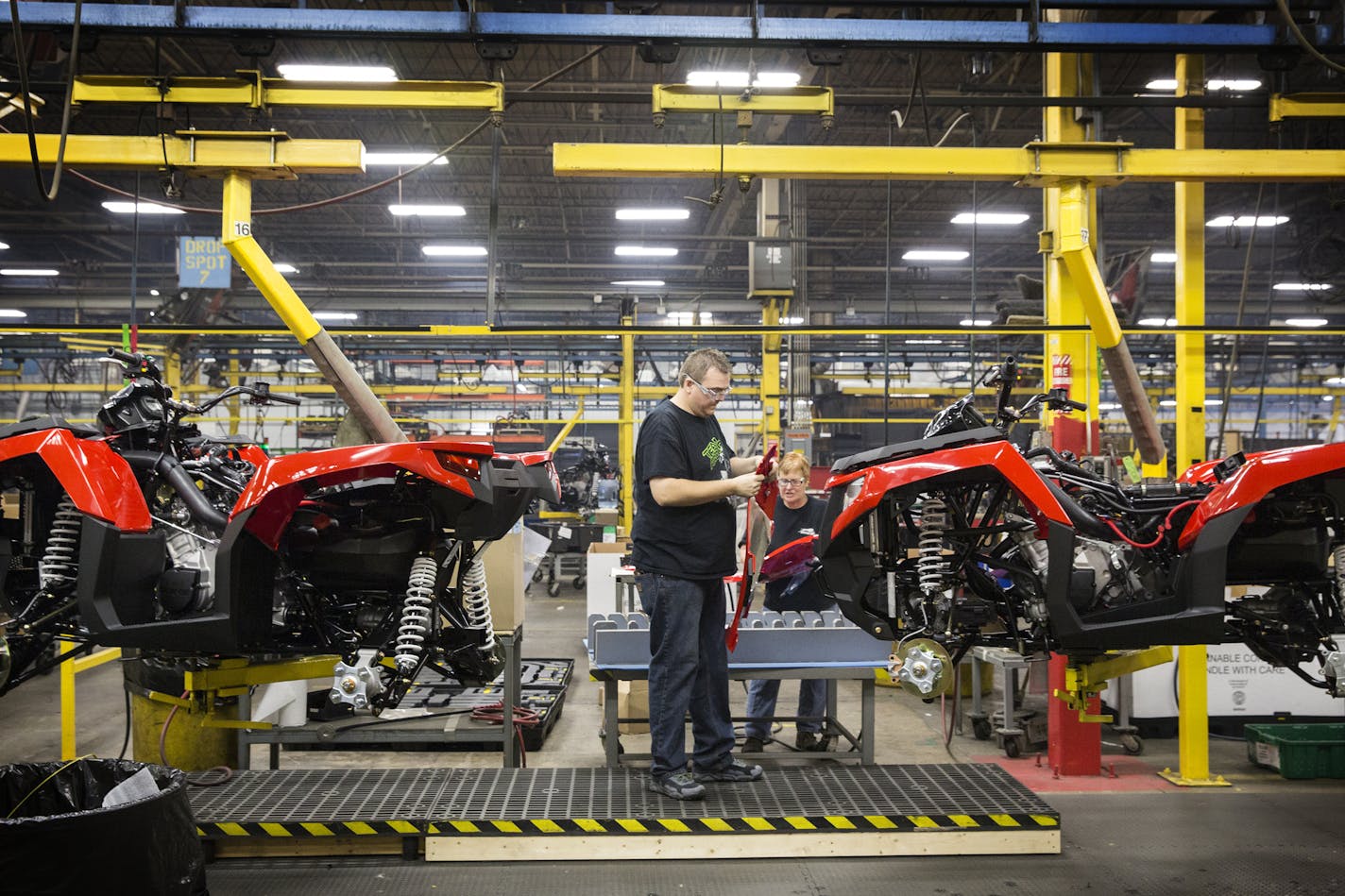 Factory workers assemble Altera ATVs in the Arctic Cat factory in Thief River Falls in 2015. (LEILA NAVIDI/Star Tribune)