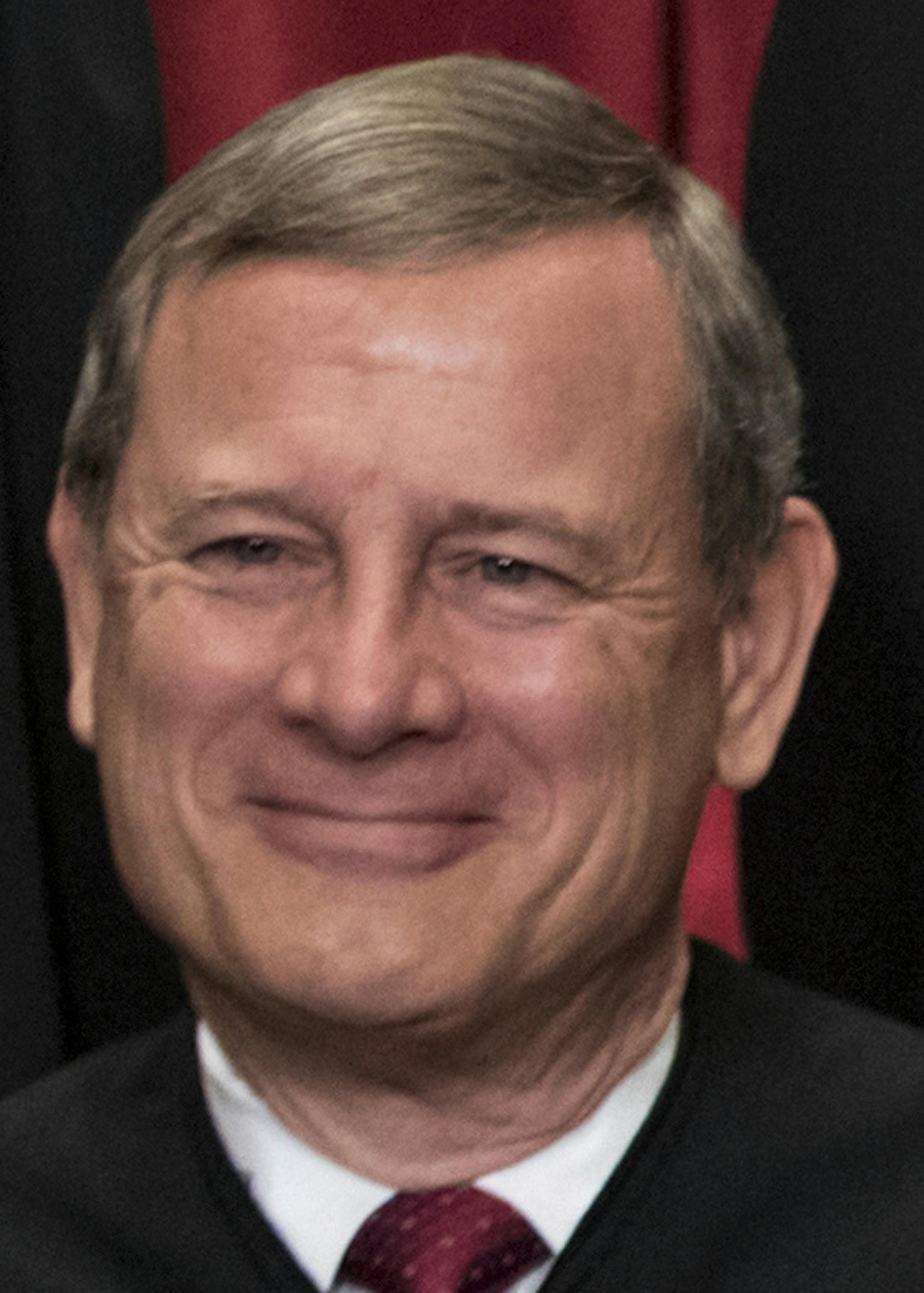 Chief Justice John Roberts joins other justices of the U.S. Supreme Court for an official group portrait at the Supreme Court Building in Washington, Thursday. June 1, 2017. He took his seat on September 29, 2005, having been nominated by President George W. Bush after the death of Chief Justice William Rehnquist. (AP Photo/J. Scott Applewhite) ORG XMIT: DCSA117