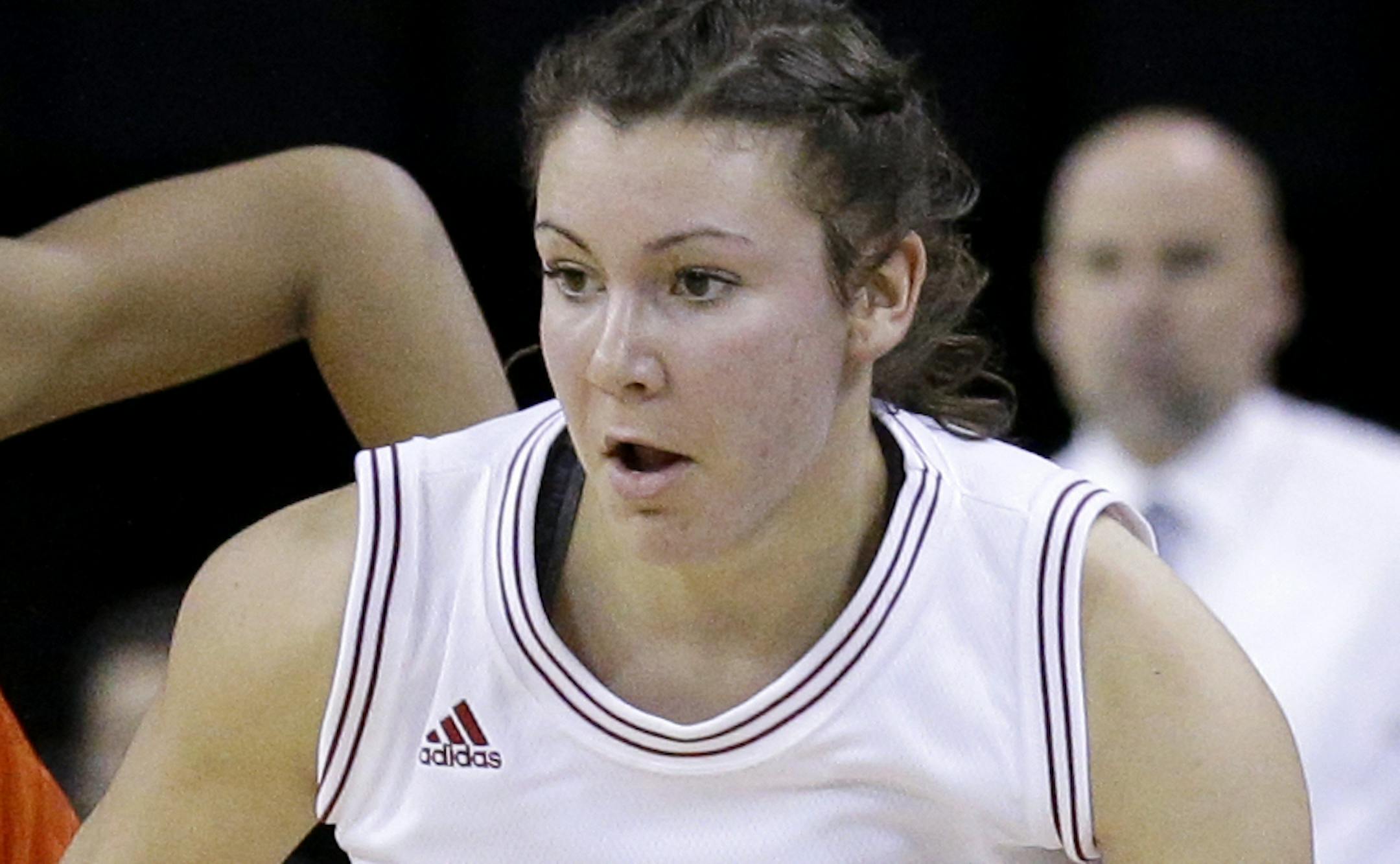 Nebraska guard Natalie Romeo, right, dribbles past Illinois guard Amarah Coleman during the second half of an NCAA college basketball game in the Big Ten women's tournament in Hoffman Estates, Ill., on Thursday, March 5, 2015. Nebraska won 86-71. (AP Photo/Nam Y. Huh)