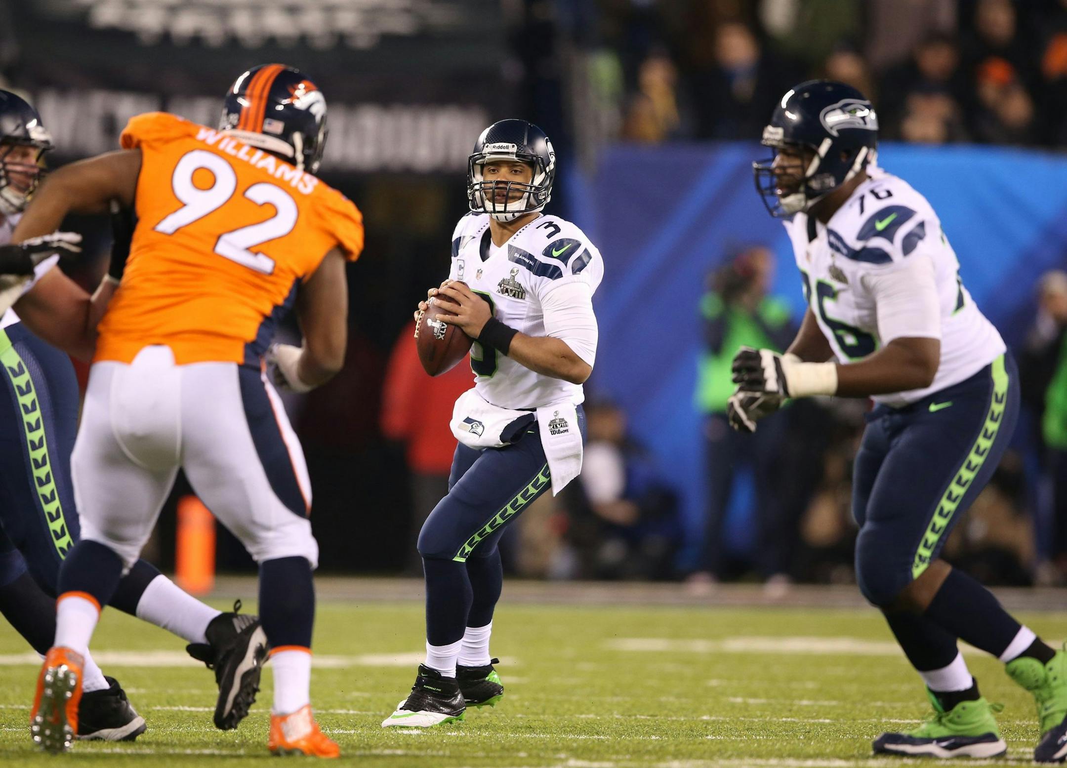 Russell Wilson (3) of the Seattle Seahawks looks to pass against the Denver Broncos during the second half of Super Bowl XLVIII at MetLife Stadium in East Rutherford, N.J., on Sunday, Feb. 2, 2014. (Lionel Hahn/Abaca Press/MCT)