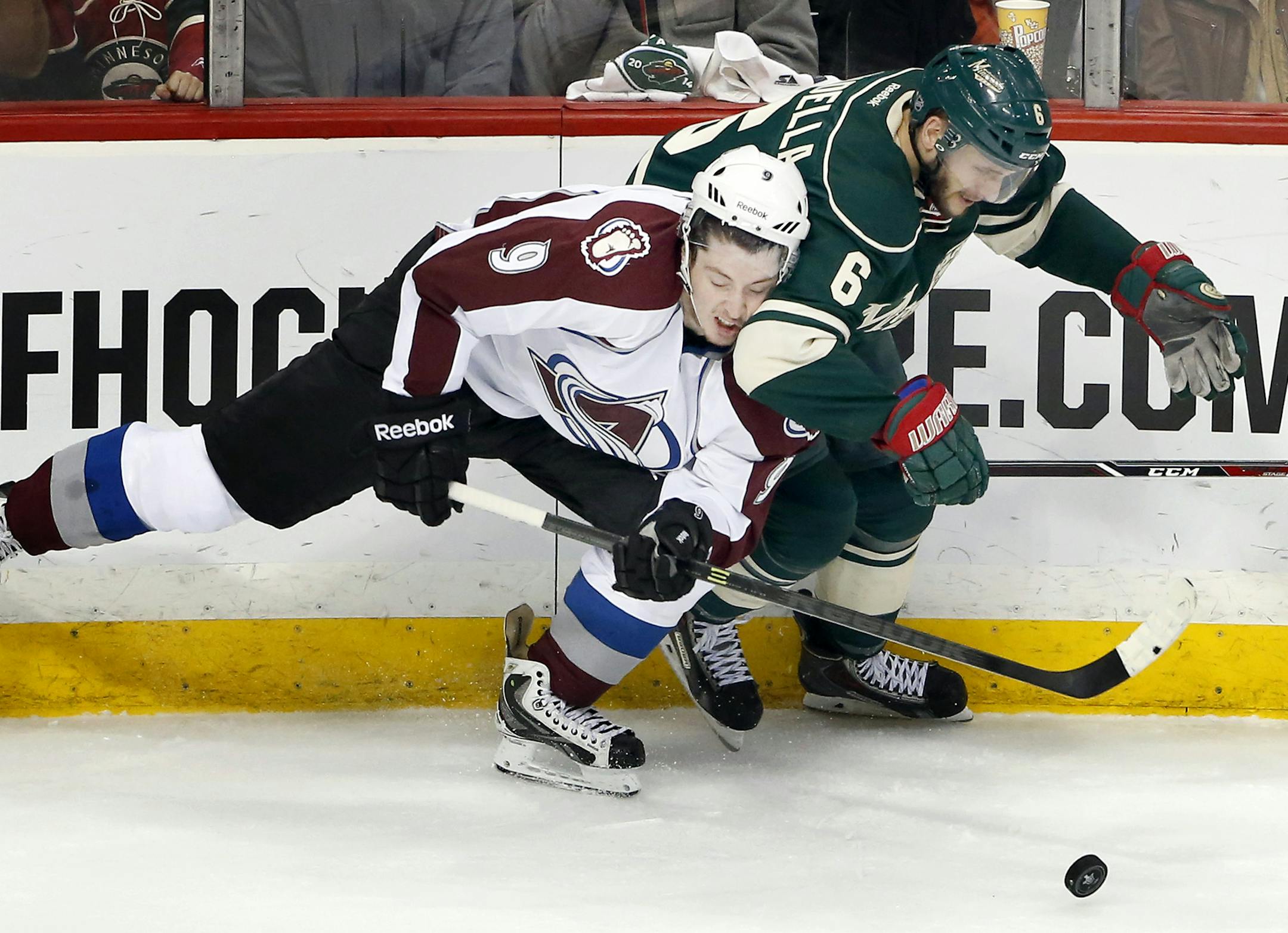 Matt Duchene (9) and Marco Scandella (6) fought for the puck in the first period. ] CARLOS GONZALEZ cgonzalez@startribune.com - April 28, 2014, St. Paul, Minn., Xcel Energy Center, NHL, Minnesota Wild vs. Colorado Avalanche, Stanley Cup Playoffs round 1, Game 6