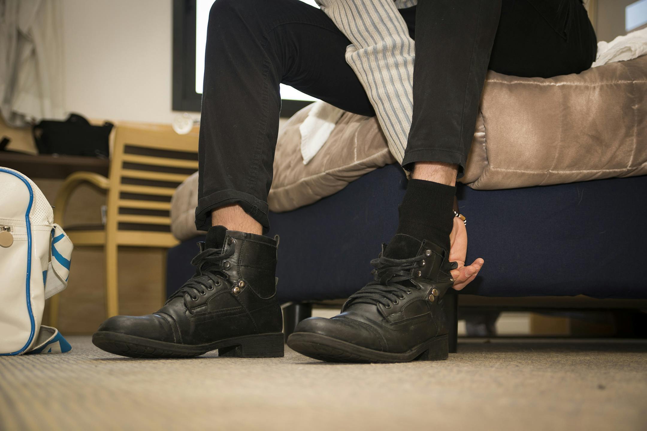 Experts say wearing shoes in the house can damage your floors and track in dirt and toxins. (Dreamstime/TNS)