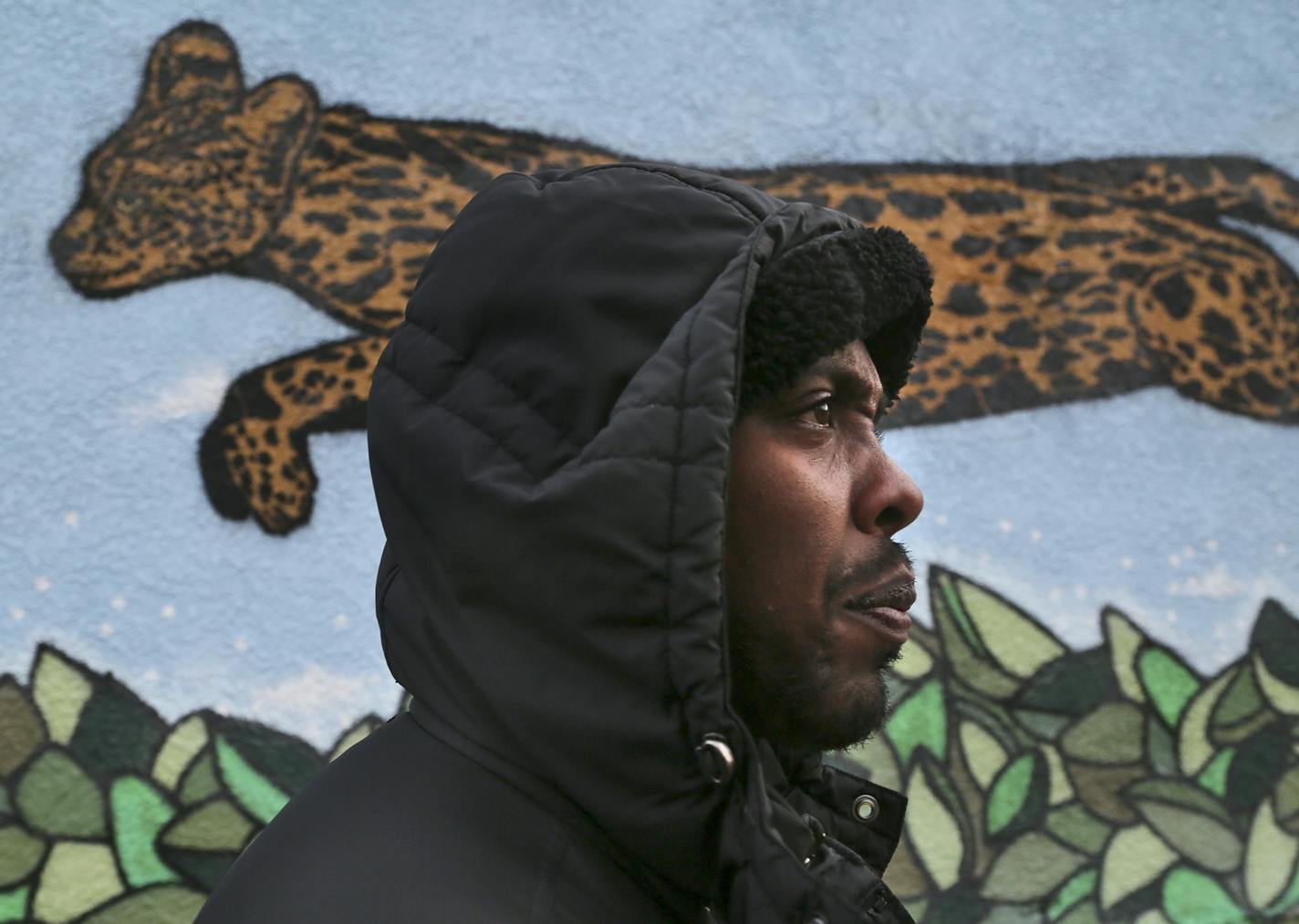 As election night winds down, Ward 6 City Council candidate Abdi Warsame, who was declared the winner Tuesday, Nov. 5, 2013, walks outside his campaign headquarters in the Cedar-Riverside neighborhood where a mural is painted on the building in Minneapolis, MN.](DAVID JOLES/STARTRIBUNE) djoles@startribune.com Minneapolis City Council race: Should know the results of some, including in Ward 6, where Abdi Warsame could win, becoming the highest elected Somali-American in the country. ORG XMIT: MIN