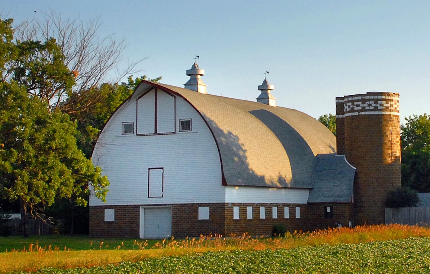 Richard Sennott&#x2022;rsennott@startribune.com] A picture perfect arch-roof dairy barn, built in 1942 on what was once an Eden Prairie farm is threatened by the widening of Pioneer Trail on the west side of Eden Prairie and the clock is rapidly ticking on its fate. The white and tan barn and attached silo stands in full view of passing traffic as an icon of a by-gone era when a farmer could make a living with 25 to 30 milk cows, said Robert Vogel, an architectural historian hired to advise Henn