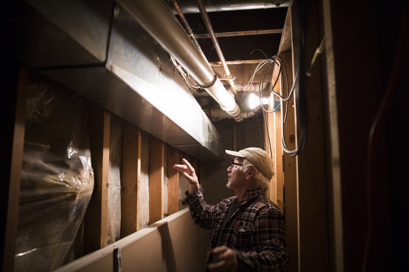 Bernie Brown shows off his basement, which was totally unfinished when he moved into the house in 1993. Brown spend thousands of dollars refinishing it himself , and believes that his esophageal cancer was linked to his home's foundation made of old car battery casings contaminated with lead. ] LEILA NAVIDI &#xef; leila.navidi@startribune.com BACKGROUND INFORMATION: Bernie Brown knew the old, dilapidated lakeshore property in White Bear Lake would be a major undertaking when he bought it in 1993