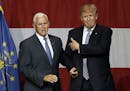 Indiana Gov. Mike Pence joins Republican presidential candidate Donald Trump at a rally in Westfield, Ind., Tuesday, July 12, 2016. (AP Photo/Michael 
