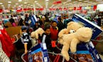 IMAGE DISTRIBUTED FOR TARGET - Guests take advantage of Target's Black Friday sales at the Jersey City, N.J. store Thursday, Nov. 26, 2015. (Noah K. M